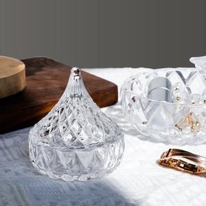 Elegant diamond-cut glass jewelry storage jars with lids and matching display bowl