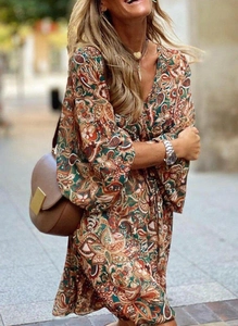 Detailed view of Bohemian V-neck printed dress with drawstring and elastic cuffs