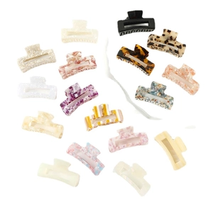 Assorted multicolor acetate bow hair claws in marble and tortoiseshell patterns