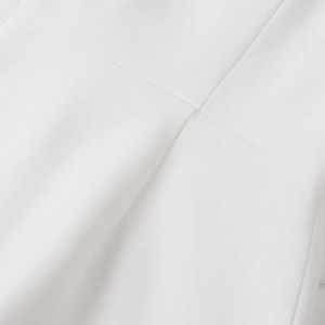 Macro shot of high-quality white fabric texture and seam lines for women's suit set