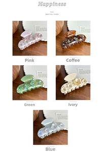 Detail of floral hair claws with rhinestones in pink, coffee, green, cream, and blue colors