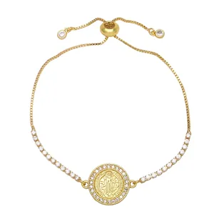 Bracciale regolabile in oro con medaglia di San Benedetto e zirconi scintillanti
