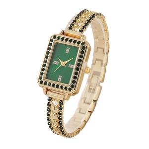Vintage women's gold bracelet watch with green rectangular dial and gemstone links