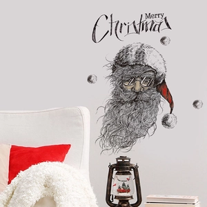 Detail of Santa Claus sketch wall sticker with Merry Christmas typography on gray wall