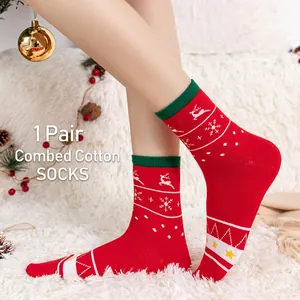 Festive red Christmas crew socks in combed cotton featuring reindeer and snowflake patterns