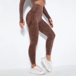 Detail of high-waist seamless brown acid wash yoga leggings and long sleeve thumbhole top