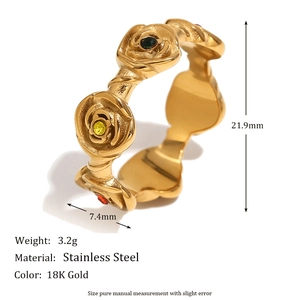 Close-up of 18K gold stainless steel ring featuring rose motif and colored gemstones