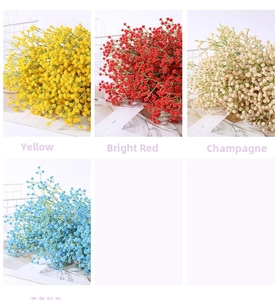 Close-up of colorful artificial gypsophila flowers in yellow, red, and champagne hues
