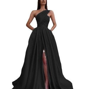 Detail of elegant black one-shoulder satin evening gown with thigh-high slit and waist pleats