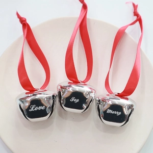 Set of 3 silver Christmas bells with red ribbons engraved with Love, Joy, and Merry text