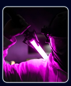 Close-up of high-quality purple glowing lightsaber toy with detailed sci-fi light effects
