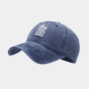 Washed blue denim baseball cap with white cross and motivational text for outdoor wear