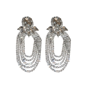 Exaggerated silver drop earrings with oval rhinestones and long cascading tassels