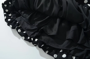 Detailed view of the sewing craftsmanship and smooth black lining of the polka dot shorts