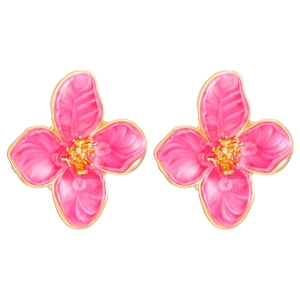 Macro view of pink enamel flower earrings with intricate golden metal floral petal details