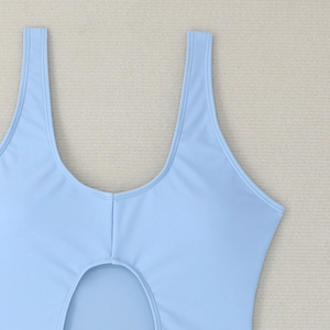 Close-up of light blue swimwear featuring a U-neckline and circular cutout detail