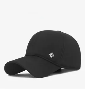 Side view of a black winter baseball cap featuring a diamond metal logo and ear protection