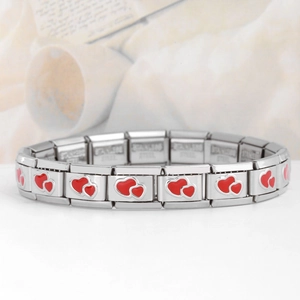 Close-up of stainless steel modular charm bracelet with red enamel double heart patterns