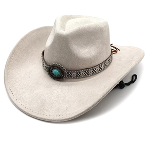 Detail of beige cowboy hat with bohemian embroidered band and turquoise metal stud