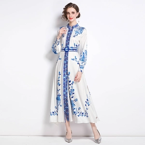 Elegant ivory maxi dress with blue floral print, mandarin collar and matching belt