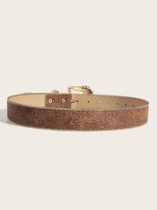 Detail of brown leather belt with floral embossing, gold bead trim and buckle