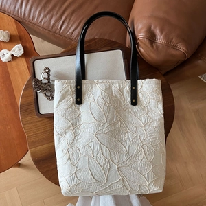 French vintage beige canvas tote bag with leaf embroidery and black leather straps