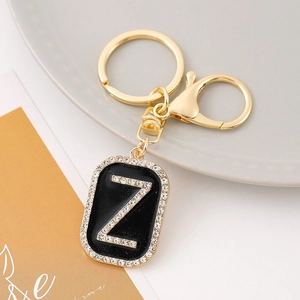 Macro shot of gold-plated rectangular keychain featuring a sparkling rhinestone letter Z