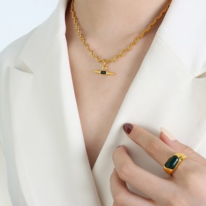Golden rope chain necklace with rectangular pendant and matching green stone signet ring