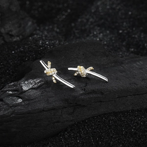 Elegant S925 silver knot earrings with gold accents and sparkling cubic zirconia stones