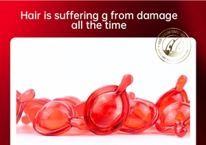 Detail of red hair oil capsules for damaged hair repair and intense shine nourishment