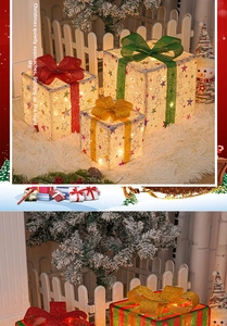 Detail of three-piece glowing Christmas gift boxes with mesh stars and warm LED lights