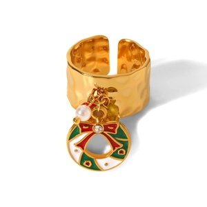 Detail of gold Christmas wreath ring with wave texture, enamel charms, and pearls