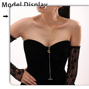 Detailed close-up of mixed metal chain necklace with OT toggle clasp on model