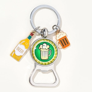 Creative metal beer bottle opener keychain with colorful charms on white background