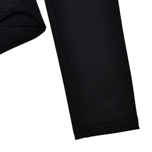 Detailed close-up of the high-elastic fabric stitching and sleeve cuff on black bodysuit
