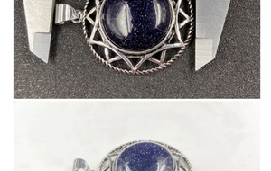 Macro shot of hexagram crystal pendant with sand stone inlay being measured by caliper