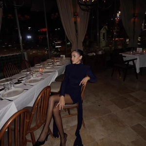 Elegant navy blue high neck long sleeve bodycon dress with flowing decorative side sash
