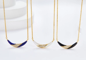 Detail of 925 silver 18K gold smile necklaces with lapis, mother of pearl and onyx
