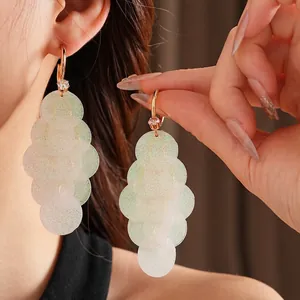 Elegant gold drop earrings with shimmering iridescent sequins and sparkling cubic zirconia