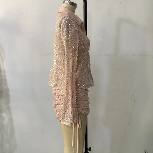 Detail of pink sequin long sleeve shirt and ruched drawstring mini skirt set for women