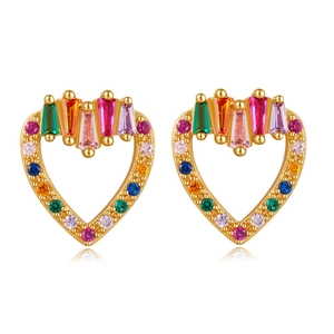 Macro shot of colorful heart-shaped zirconia stones set in gold-plated leaf earrings