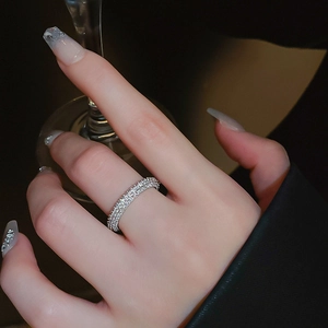 Detail of silver plated twist ring with zircon inlay worn elegantly on the finger