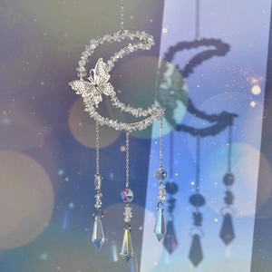 Detail of silver crescent moon suncatcher with crystal chips and butterfly prism pendant