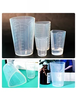 Macro detail of transparent silicone measuring cups with ml, oz, and cup graduations