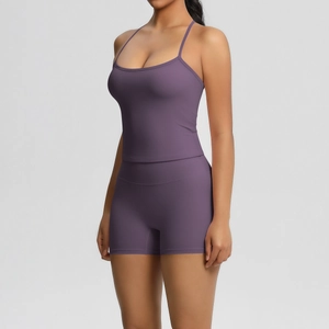 Close-up of deep purple yoga set featuring U-neck camisole and high-waist sports shorts