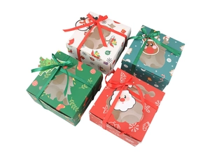 Set of Christmas cupcake boxes with ribbon and window showing festive characters