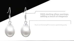 Detail of S925 sterling silver hooks with white freshwater pearls on earrings