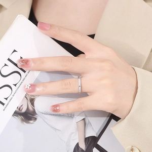 Octagon silver stainless steel ring with micro-paved shell zircons on a model's hand