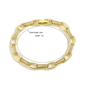 Detail of 18K gold plated U-link chain bracelet with zircon pavé setting and 18cm length