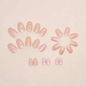 Almond-shaped nude pink fake nails with aurora glitter powder finish, smooth texture